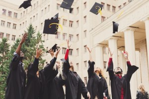 graduates throwing caps
