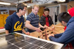 students and teaacher building something