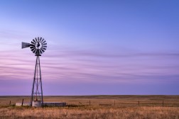 windmill in front of purple sky