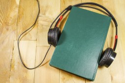 headphones and green book