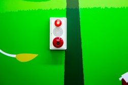red button on green wall