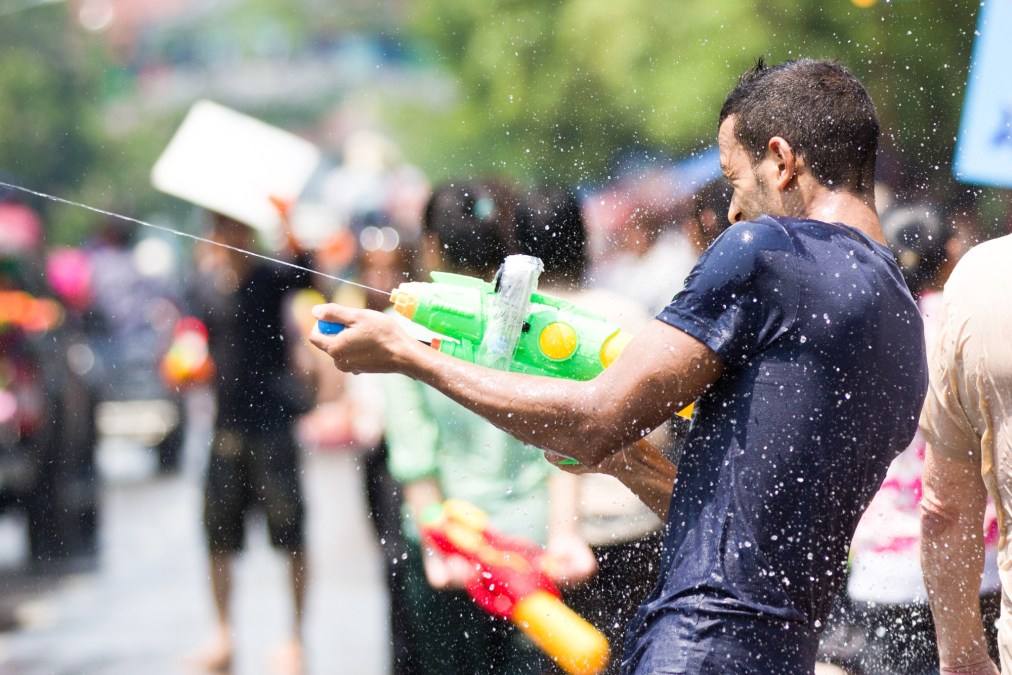 young man with water gun