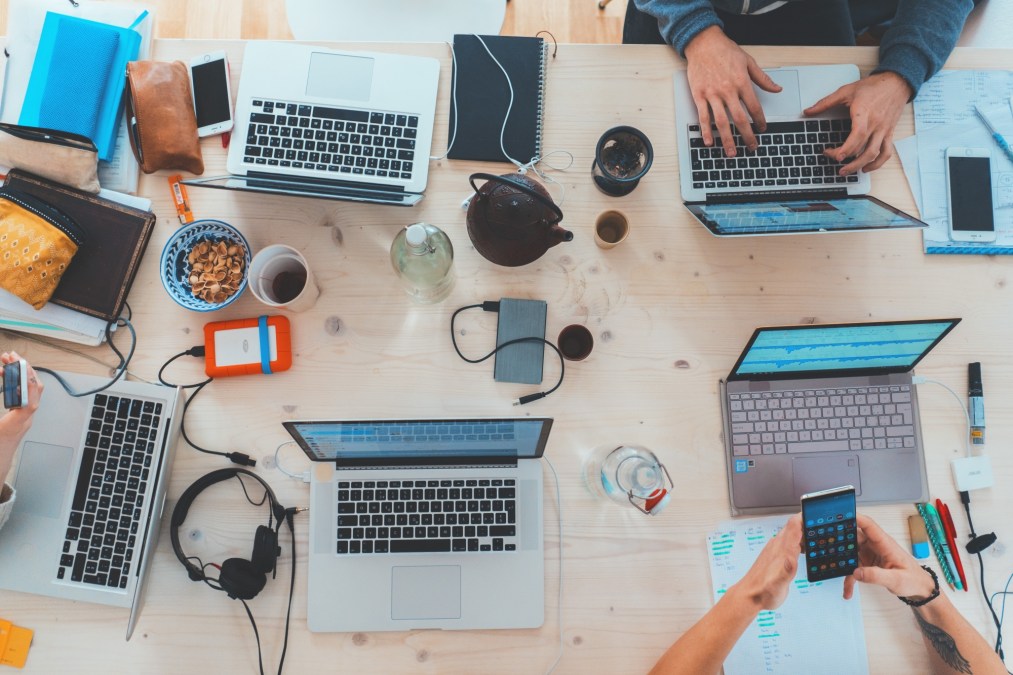 computers on desk overhead view