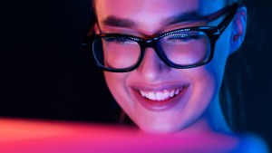 smiling woman using computer