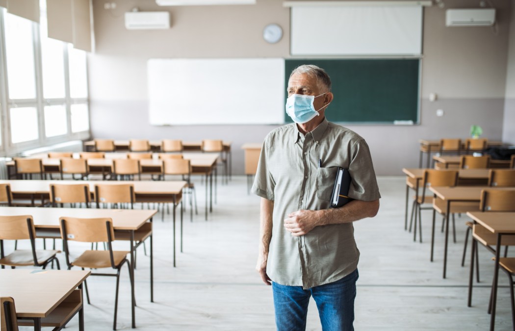 Teacher in an empty classroom