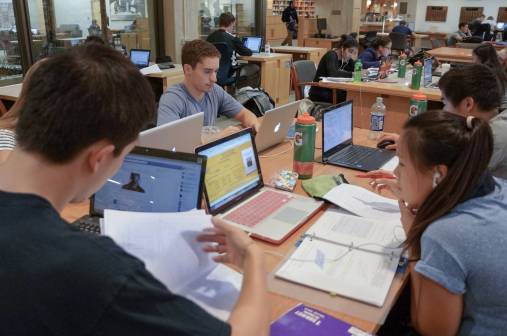 university students studying in a library