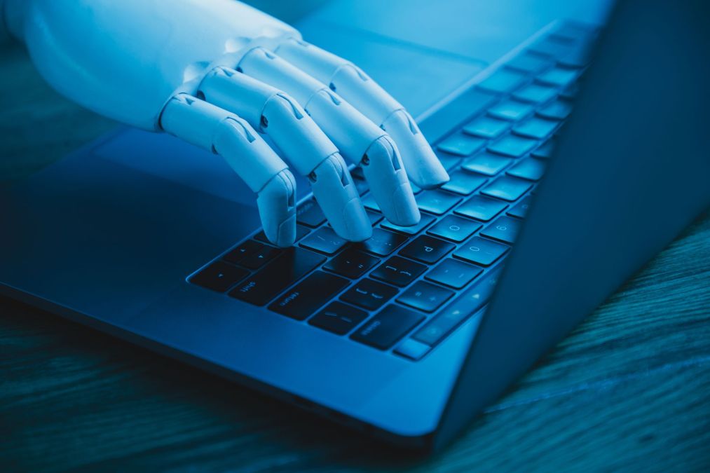 robotic hand on keyboard