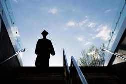 Silhouette of College Graduate Climbing Steps